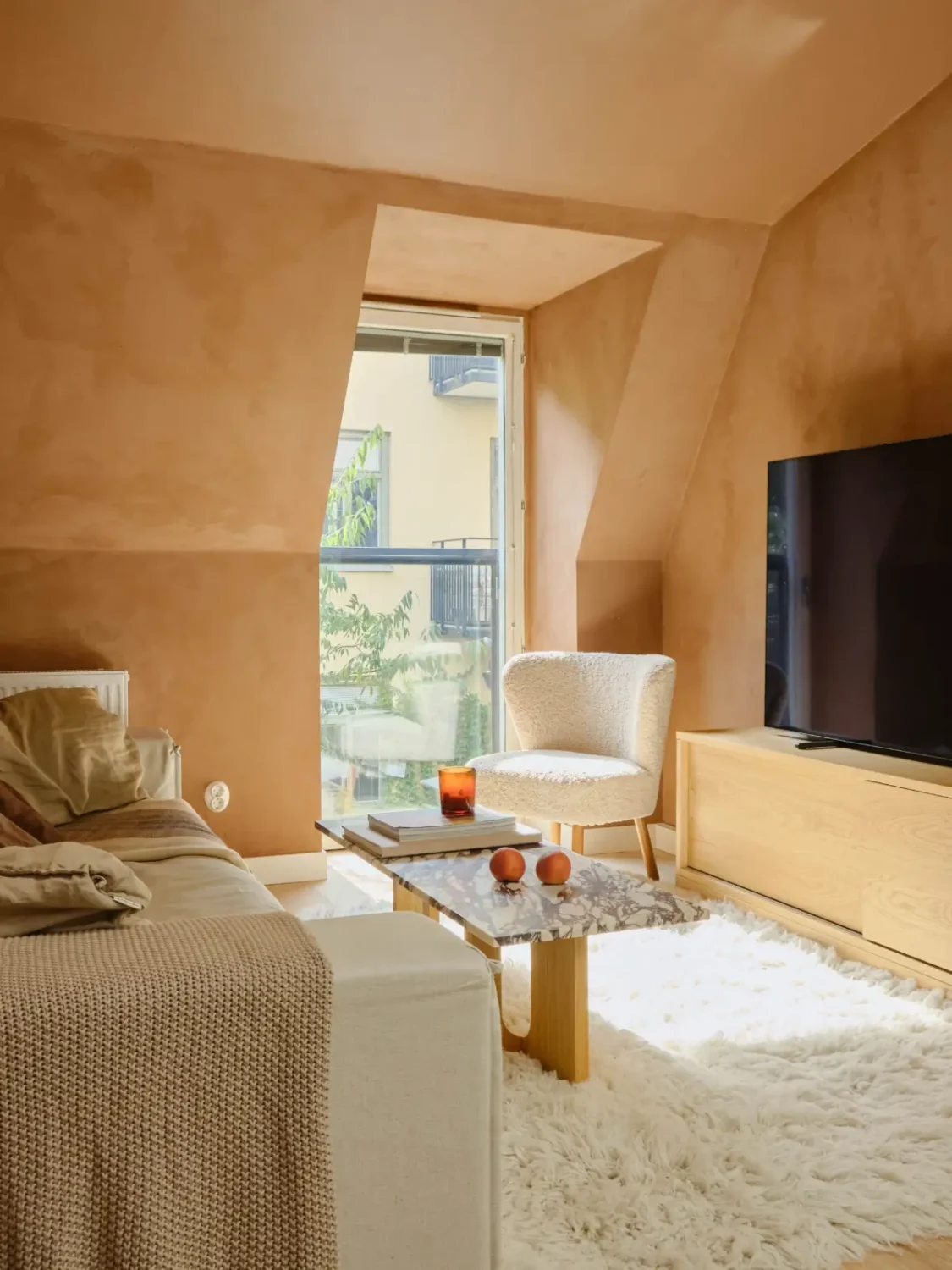Former Stables Transformed into a Modern, Light House with Plaster Walls 10 living room french balcony terracotta plaster walls