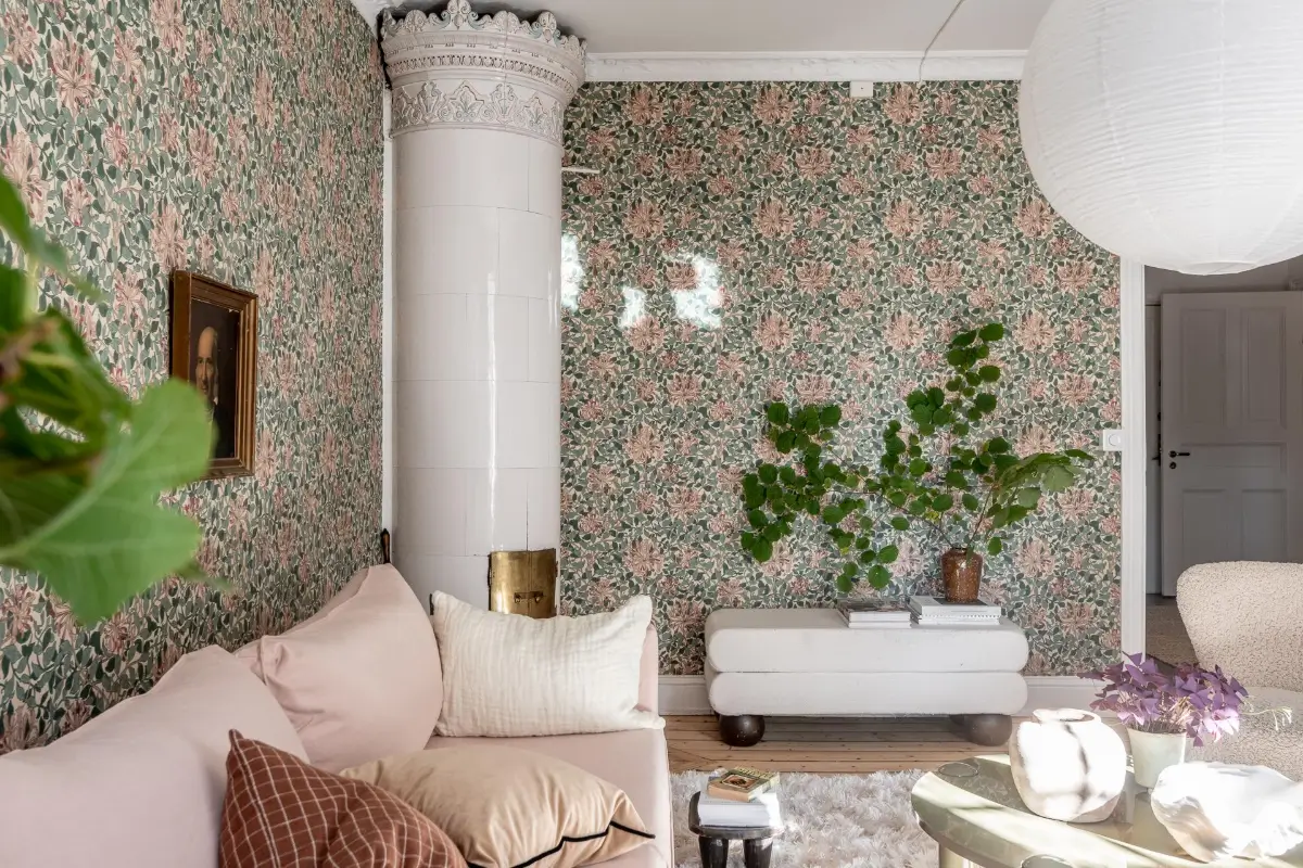 William Morris Wallpapers and Period Features in a Gothenburg Apartment 7 living room pink sofa fireplace