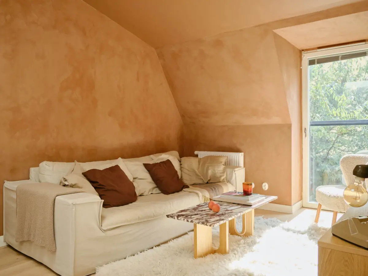 Former Stables Transformed into a Modern, Light House with Plaster Walls 13 living room plaster walls terracotta color