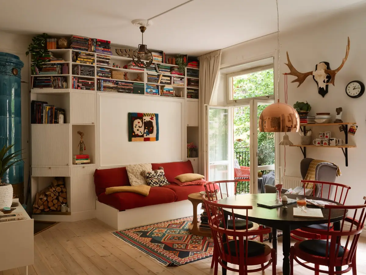 A Well-Planned Family Apartment with Historic Character 1 living room with murphy bed and round table