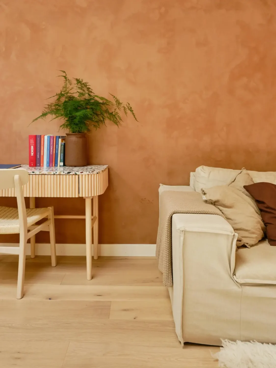 Former Stables Transformed into a Modern, Light House with Plaster Walls 14 living room with terrazzo topped desk