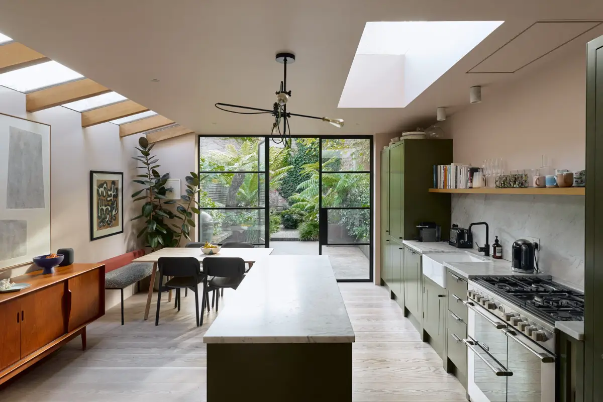 A Beautiful Victorian Townhouse Reimagined for Modern Living 11 london townhouse kitchen extension green cabinets skylights