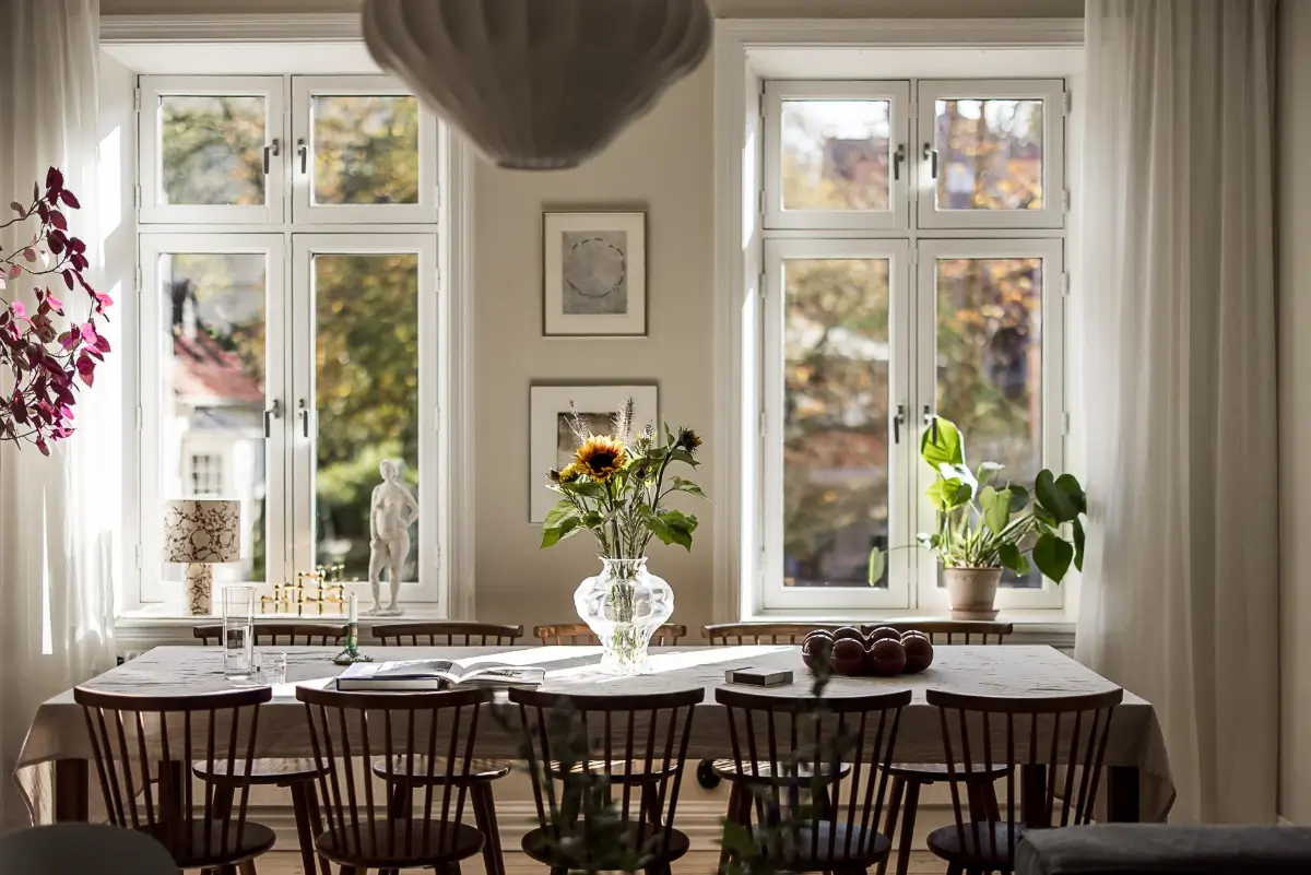 Warm Neutral Tones and Period Features in a Swedish Apartment 8 long dining table