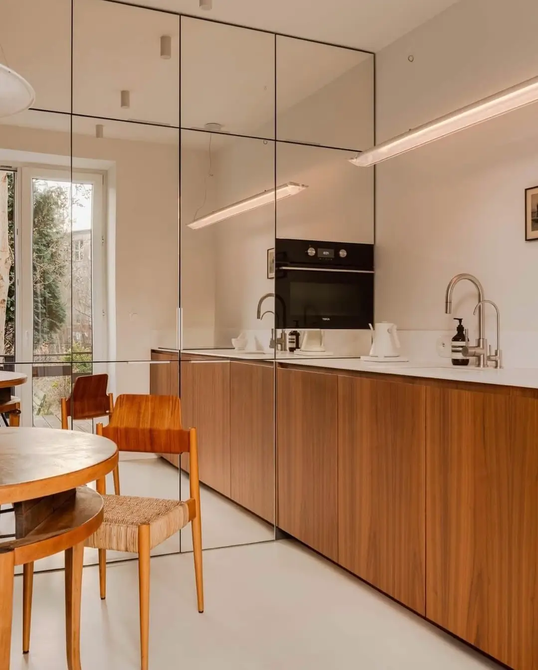 Why Everyone’s Adding Mirrors to Their Kitchens (And You Should Too) 12 mirror kitchen cabinet doors 1 Why Everyone’s Adding Mirrors to Their Kitchens (And You Should Too)
