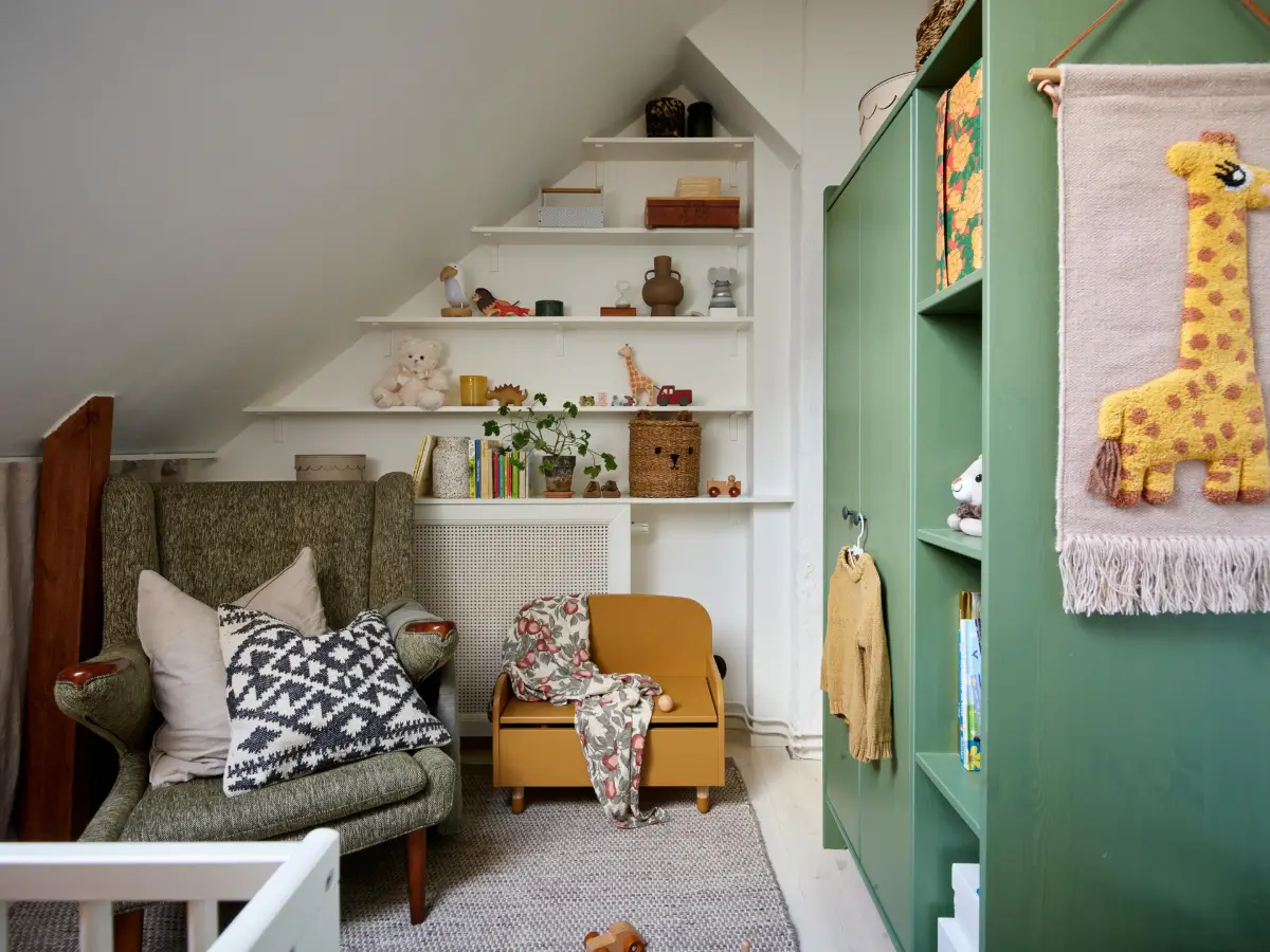 Gray Tones and High Ceilings in a Cozy Swedish Duplex Apartment 18 nursery built-in shelves green wardrobes