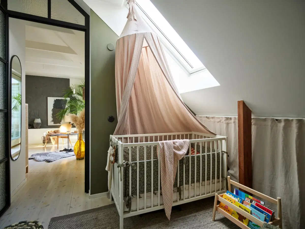 Gray Tones and High Ceilings in a Cozy Swedish Duplex Apartment 20 nursery slanted ceiling storage behind curtains