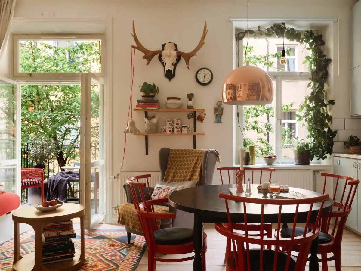 A Well-Planned Family Apartment with Historic Character 3 open-plan living room round dining table colorful rug