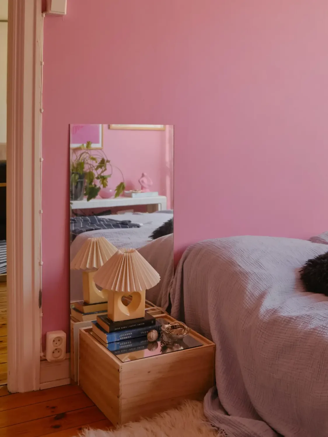 A Light 1930s Apartment with a Bubblegum Pink Bedroom 22 pink bedroom bedside table