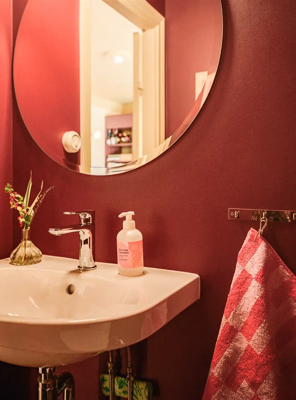 A Colorful Stockholm Family Apartment with Views of the Lake 35 red guest toilet round mirror