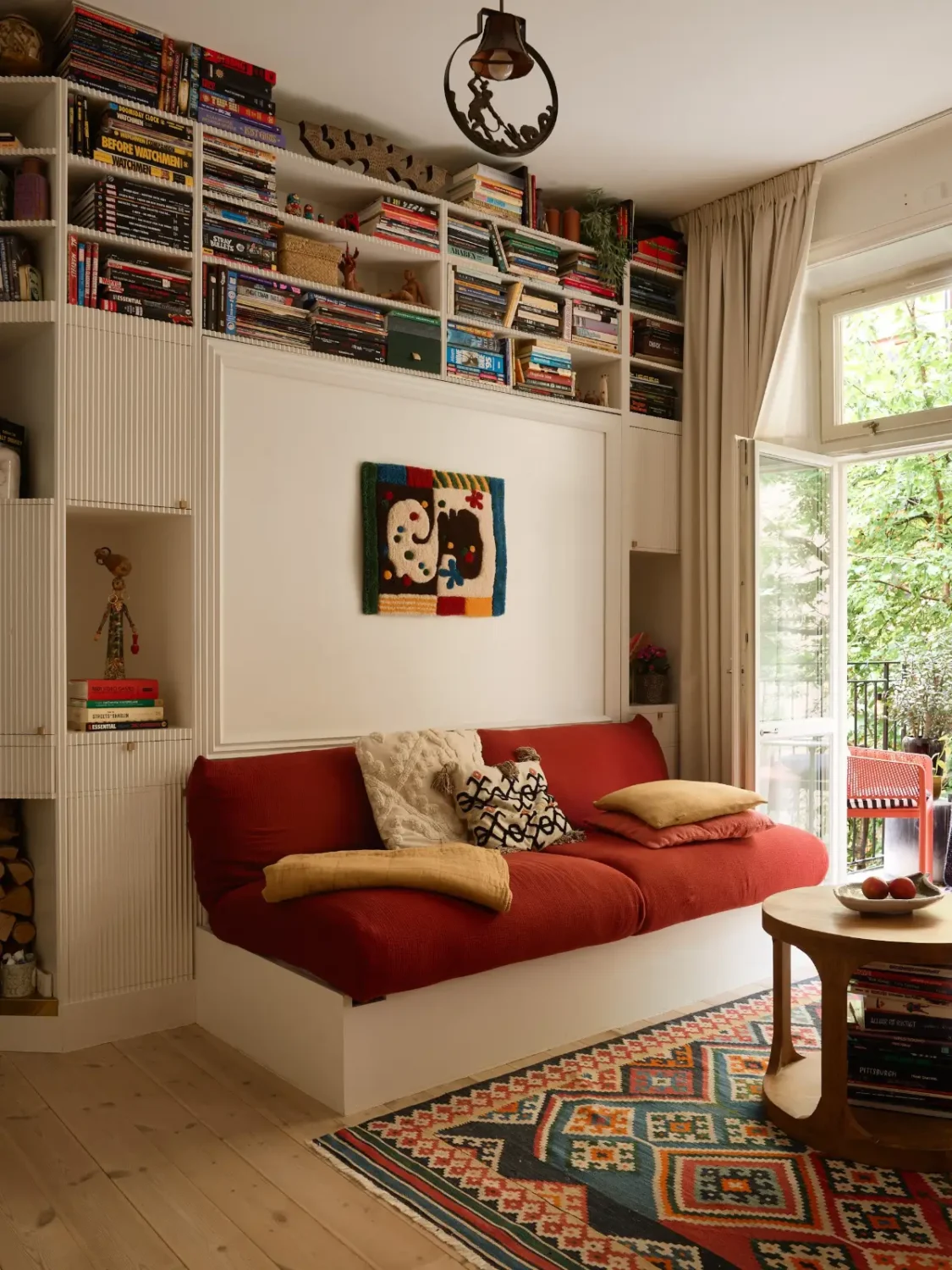 A Well-Planned Family Apartment with Historic Character 2 red sofa murphy bed