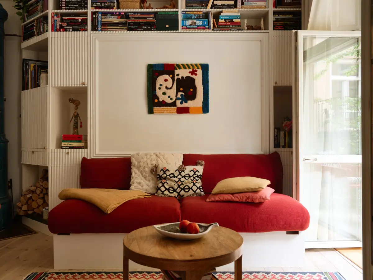 A Well-Planned Family Apartment with Historic Character 8 red sofa A Well-Planned Family Apartment with Historic Character