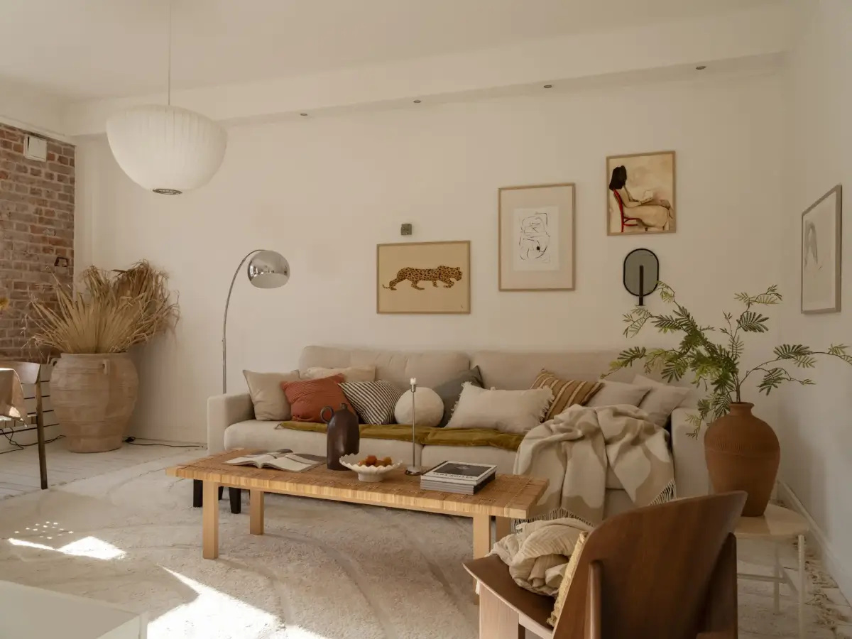 A Fresh 1920s Apartment with White Floorboards and Exposed Brick 3 scandi living room