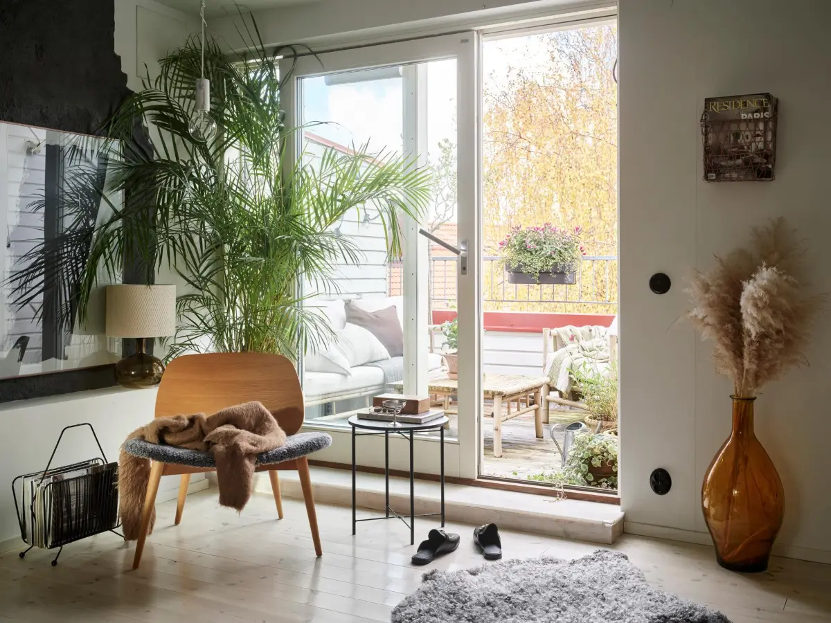 Gray Tones and High Ceilings in a Cozy Swedish Duplex Apartment 7 sliding balcony doors