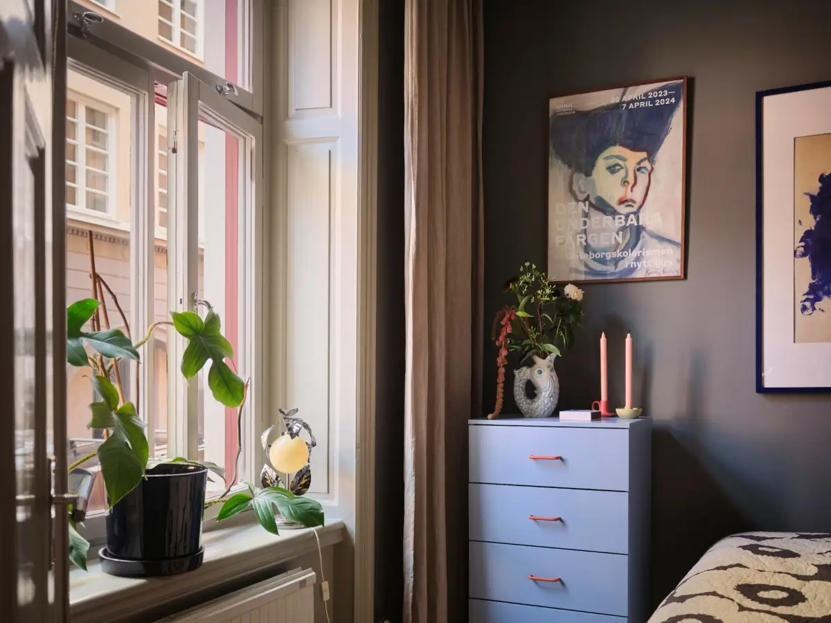 Color, Books, and a Walk-In Wardrobe in a Small Stockholm Apartment 20 small dark-colored bedroom large window nordroom