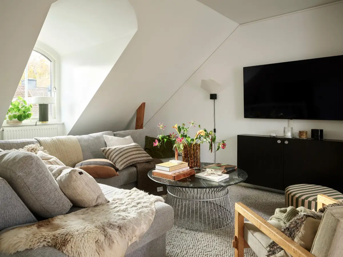 Gray Tones and High Ceilings in a Cozy Swedish Duplex Apartment 3 small living room gray corner sofa
