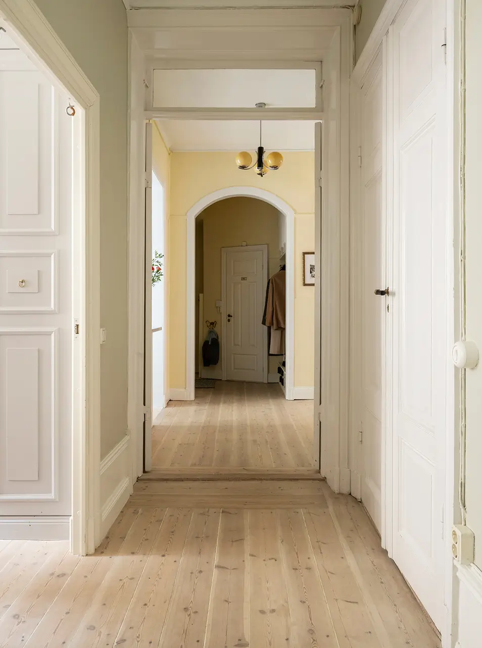 A Stylish Beige Apartment with a Light Blue Kitchen 26 spacious hall wooden floor