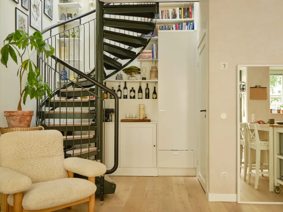 Former Stables Transformed into a Modern, Light House with Plaster Walls 8 spiral steel staircase