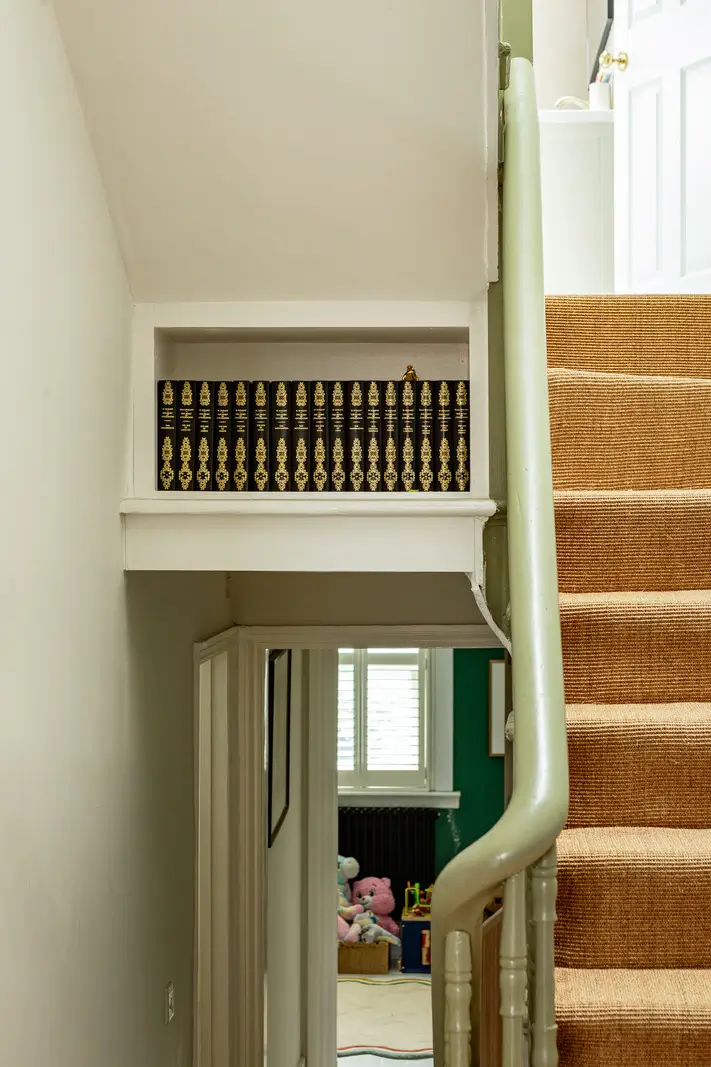 Period Elements and Subtle Color Accents in a Victorian Family Home 25 staircase books niche