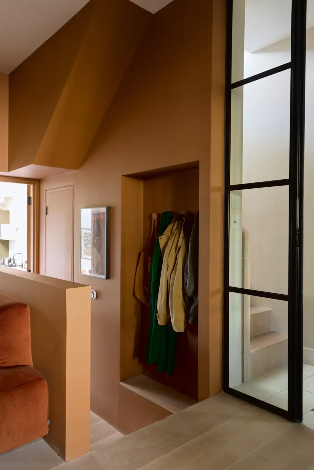 A Beautiful Victorian Townhouse Reimagined for Modern Living 10 storage niche coats terracotta walls nordroom