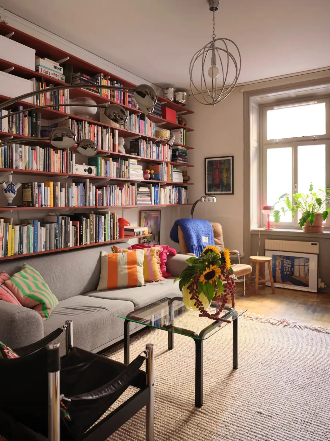 Color, Books, and a Walk-In Wardrobe in a Small Stockholm Apartment 12 swedish living room bookshelves nordroom