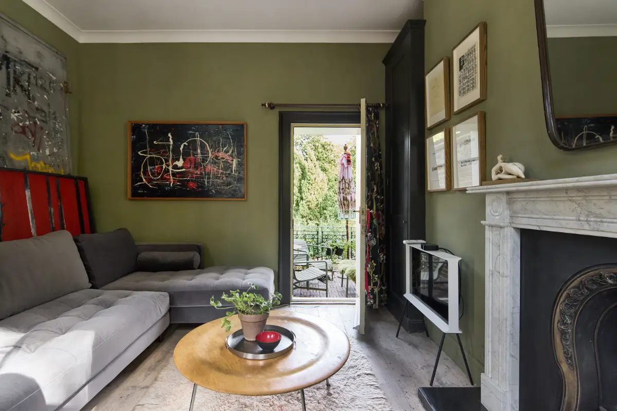 A deVOL Kitchen in a Beautiful Restored Georgian Townhouse in London 17 television room green walls marble fireplace