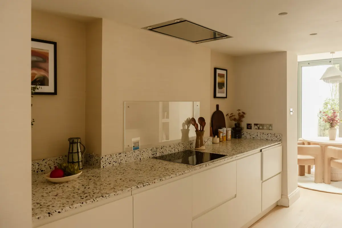 A Serene Duplex Apartment with a Glass Extension in London 8 terrazzo countertop modern white cabinets