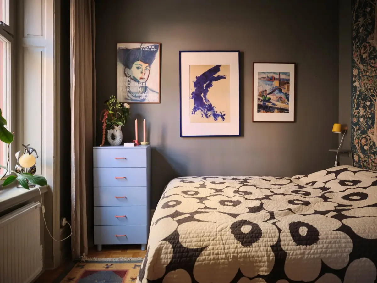 Color, Books, and a Walk-In Wardrobe in a Small Stockholm Apartment 19 tiny-dark-colored-bedroom-large-window-art-nordroom