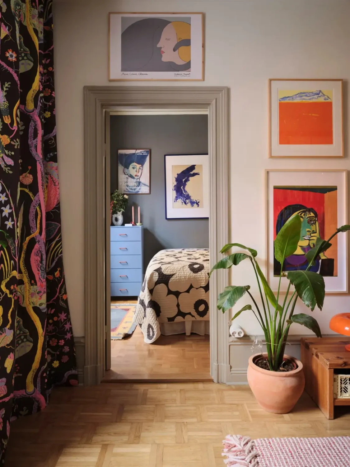 Color, Books, and a Walk-In Wardrobe in a Small Stockholm Apartment 18 view into bedroom