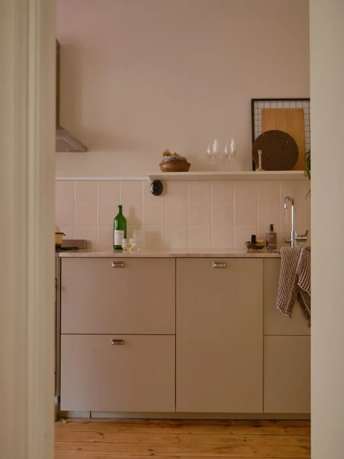 A Light 1930s Apartment with a Bubblegum Pink Bedroom 14 view into kitchen