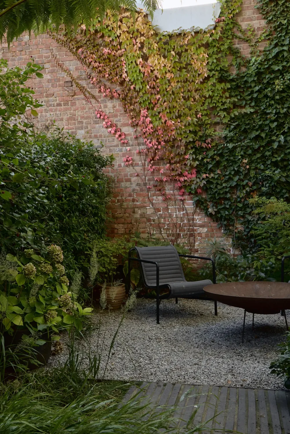 A Beautiful Victorian Townhouse Reimagined for Modern Living 21 walled garden fire pit