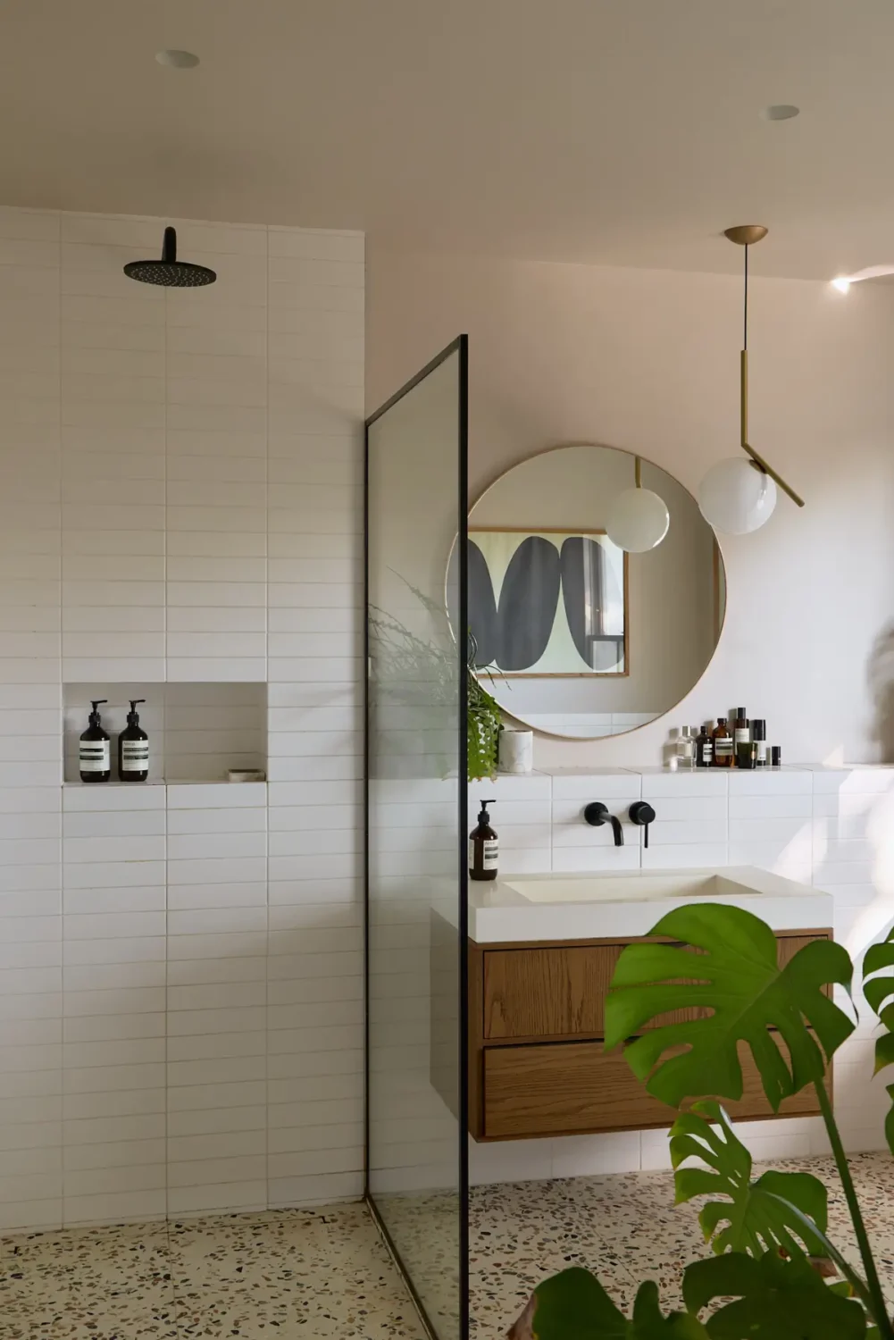 A Beautiful Victorian Townhouse Reimagined for Modern Living 33 white tiled walk-in shower terrazzo floor tiles