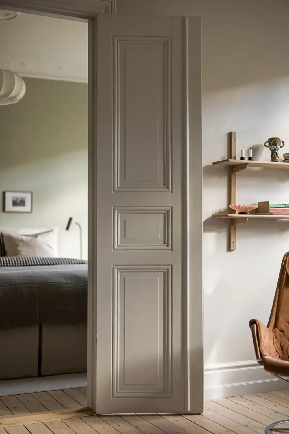 A Classic Renovated Apartment with a Social Light Green Kitchen 9 wooden door