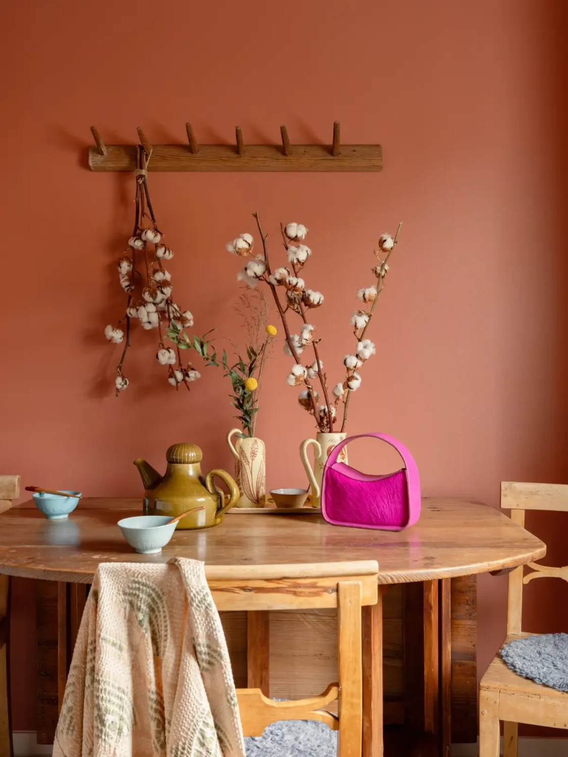 The Color Trends for 2026: A Return to Nature, Balance, and Grounding 48 wooden kitchen table terracotta walls nordroom The Color Trends for 2026: A Return to Nature, Balance, and Grounding