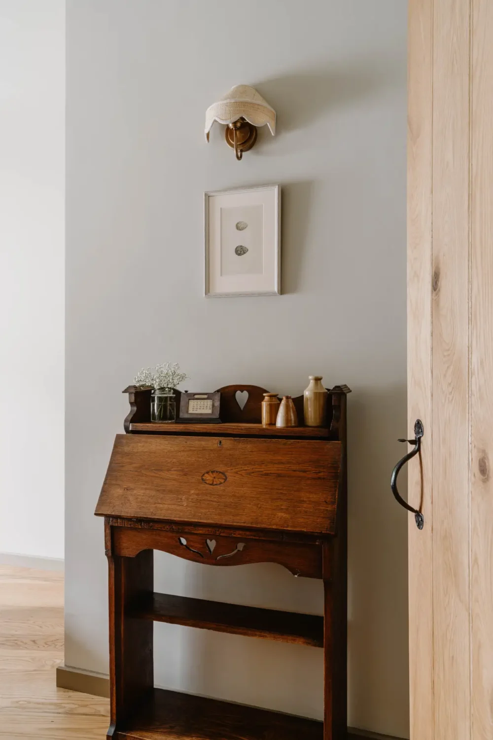 Natural Materials and Green Tones in a Pretty Coastal Home 16 antique writing desk