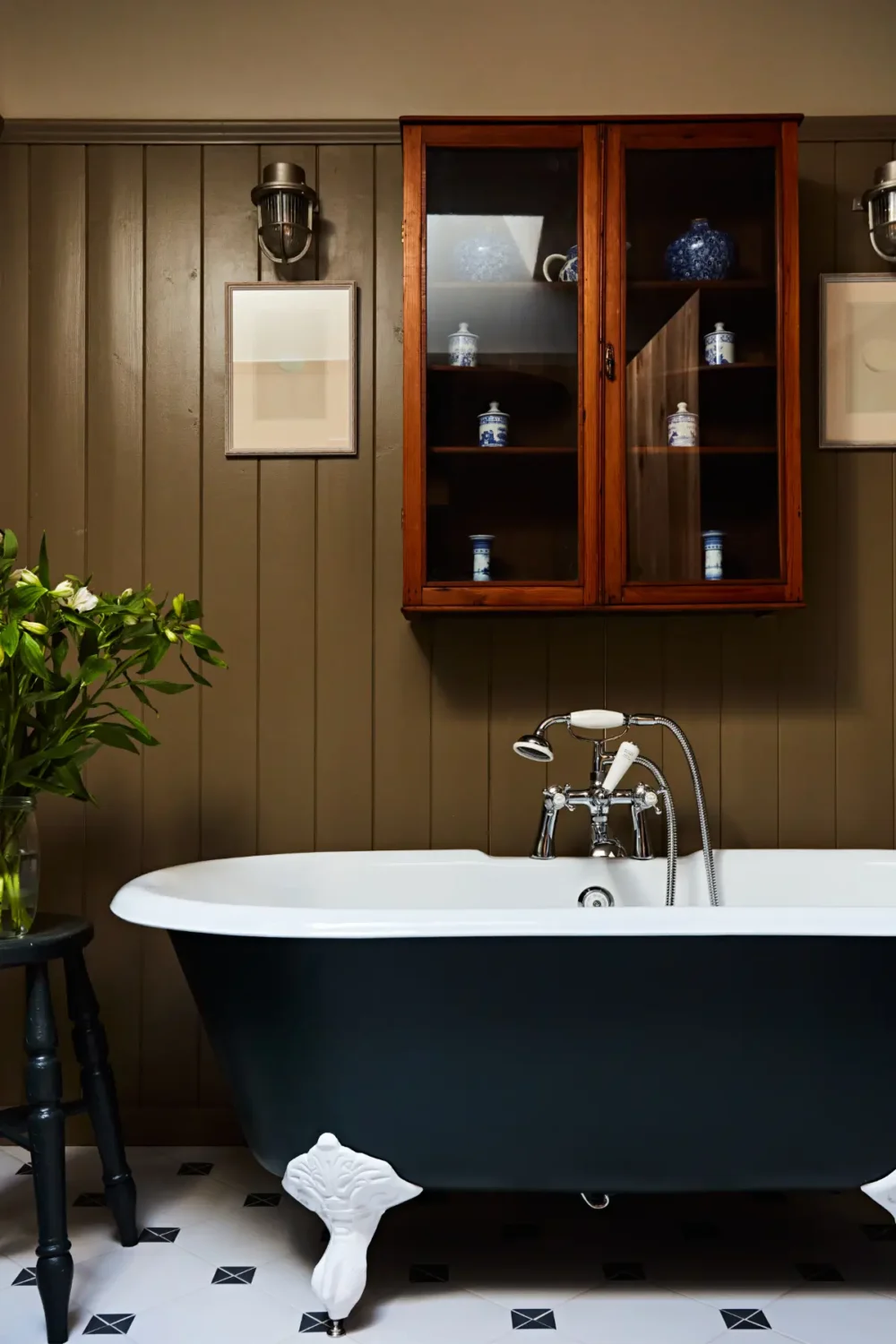 Natural Materials and Green Tones in a Pretty Coastal Home 19 bathroom freestanding bath green paneling nordroom