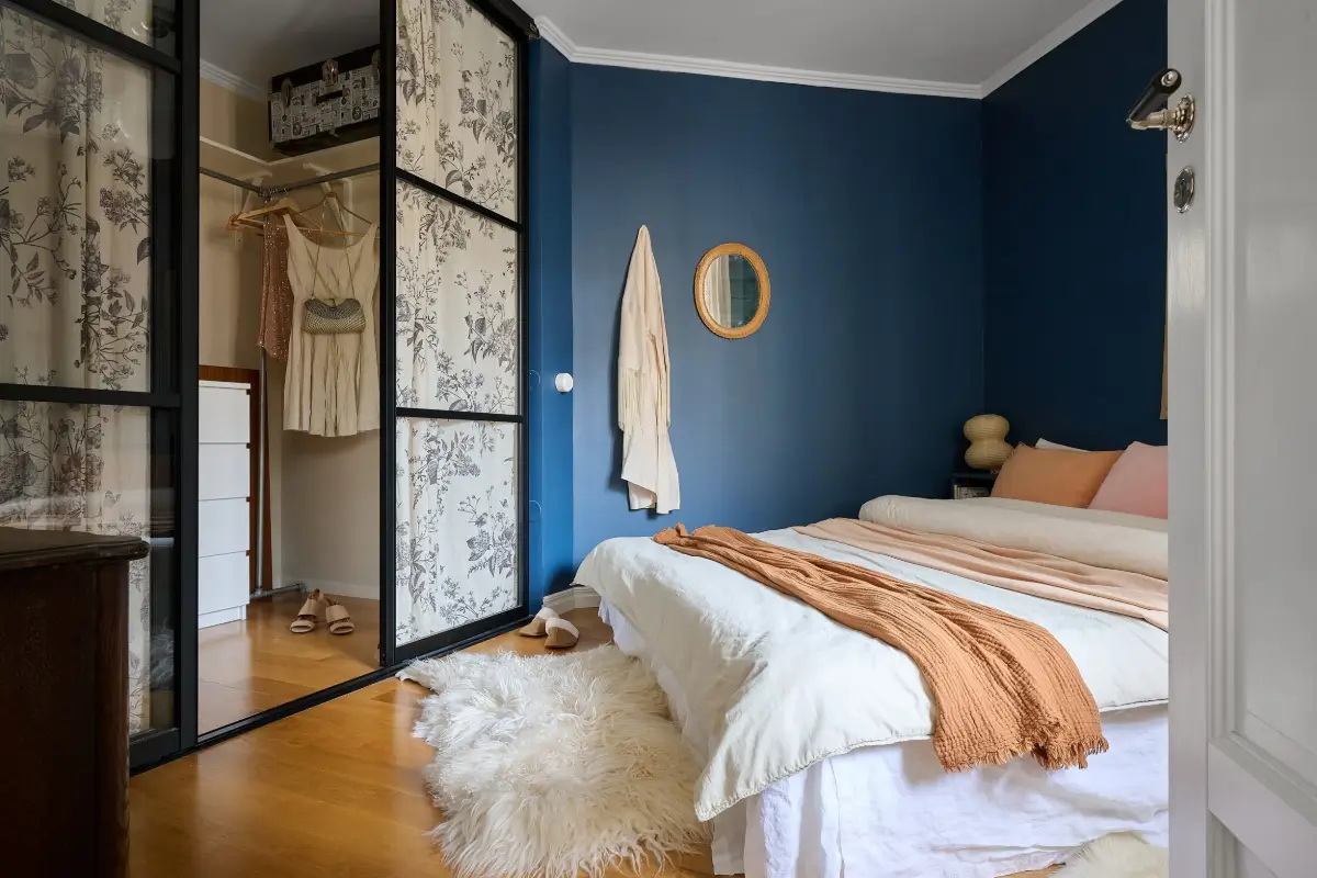 A Bright and Colorful 1930s Apartment in Stockholm 15 dark blue bedroom walk-in closet