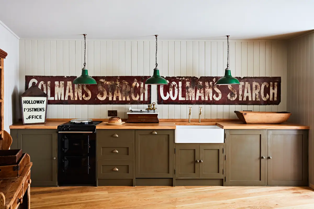 Natural Materials and Green Tones in a Pretty Coastal Home 2 green kitchen butler sink