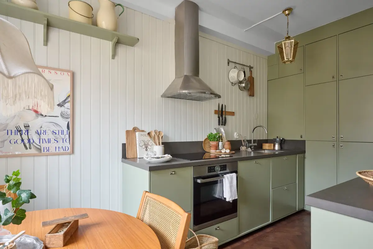 A Bright and Colorful 1930s Apartment in Stockholm 10 green kitchen paneled walls