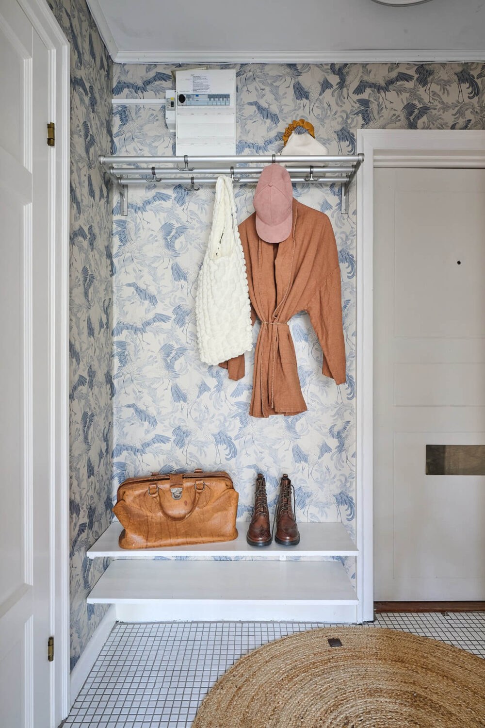 A Bright and Colorful 1930s Apartment in Stockholm 21 hall storage blue wallpaper A Bright and Colorful 1930s Apartment in Stockholm