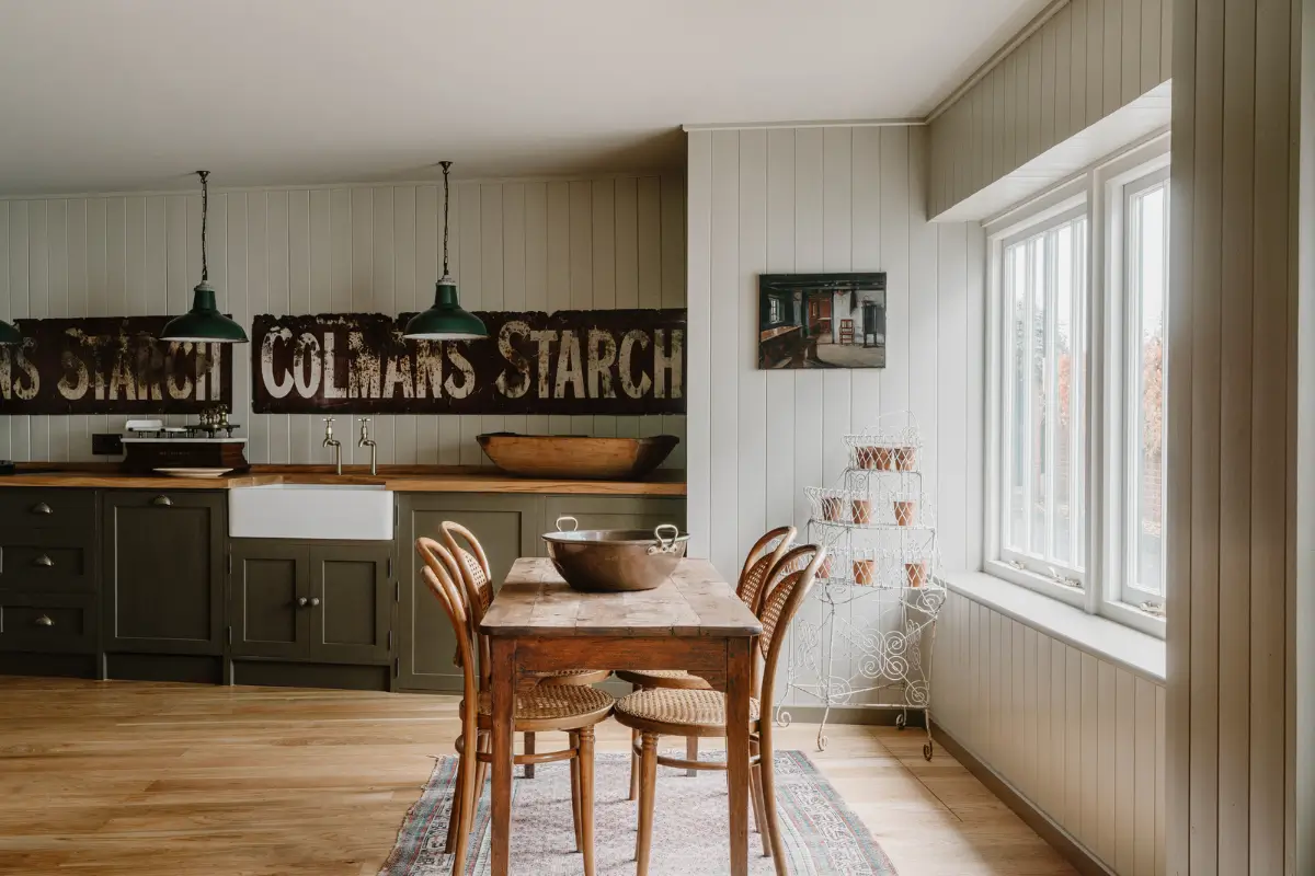 Natural Materials and Green Tones in a Pretty Coastal Home 1 kitchen rustic wooden dining table