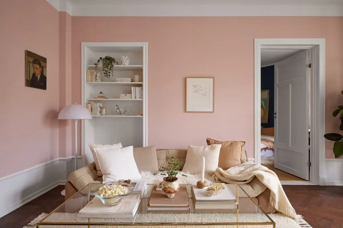 A Bright and Colorful 1930s Apartment in Stockholm 3 living room pink walls built-in shelves