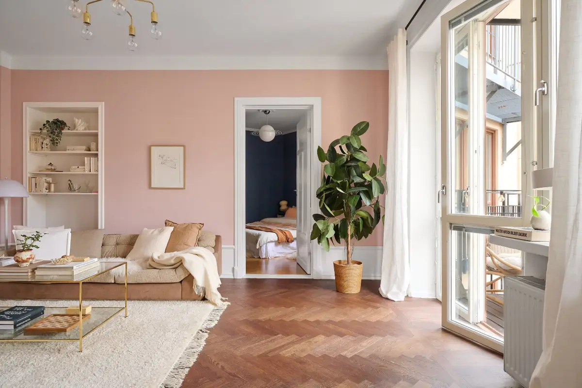 A Bright and Colorful 1930s Apartment in Stockholm 4 pink living room herringbone parquet floor