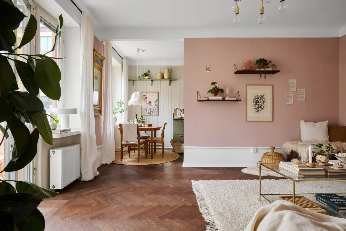 A Bright and Colorful 1930s Apartment in Stockholm 1 pink semi open plan living room parquet floor