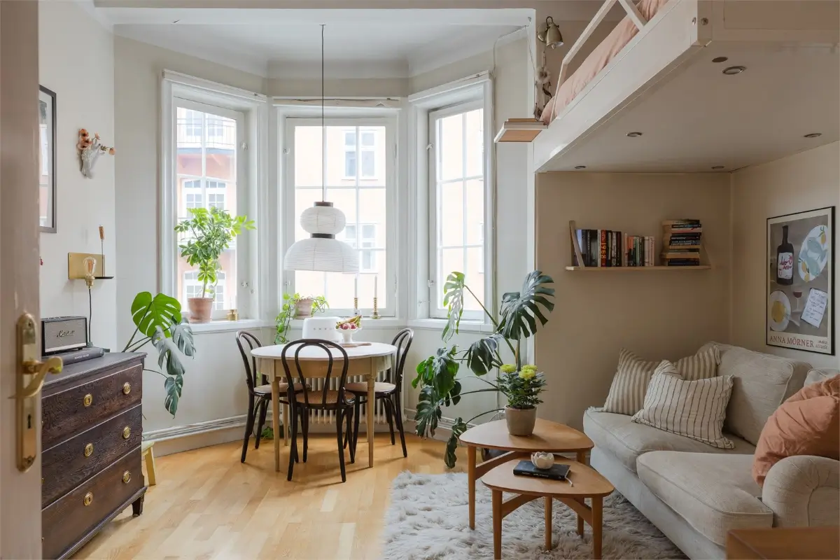 A Studio Apartment with a Large Bay Window and a Loft Bed 1 small-studio-apartment-bay-window-loft-bed-nordroom15