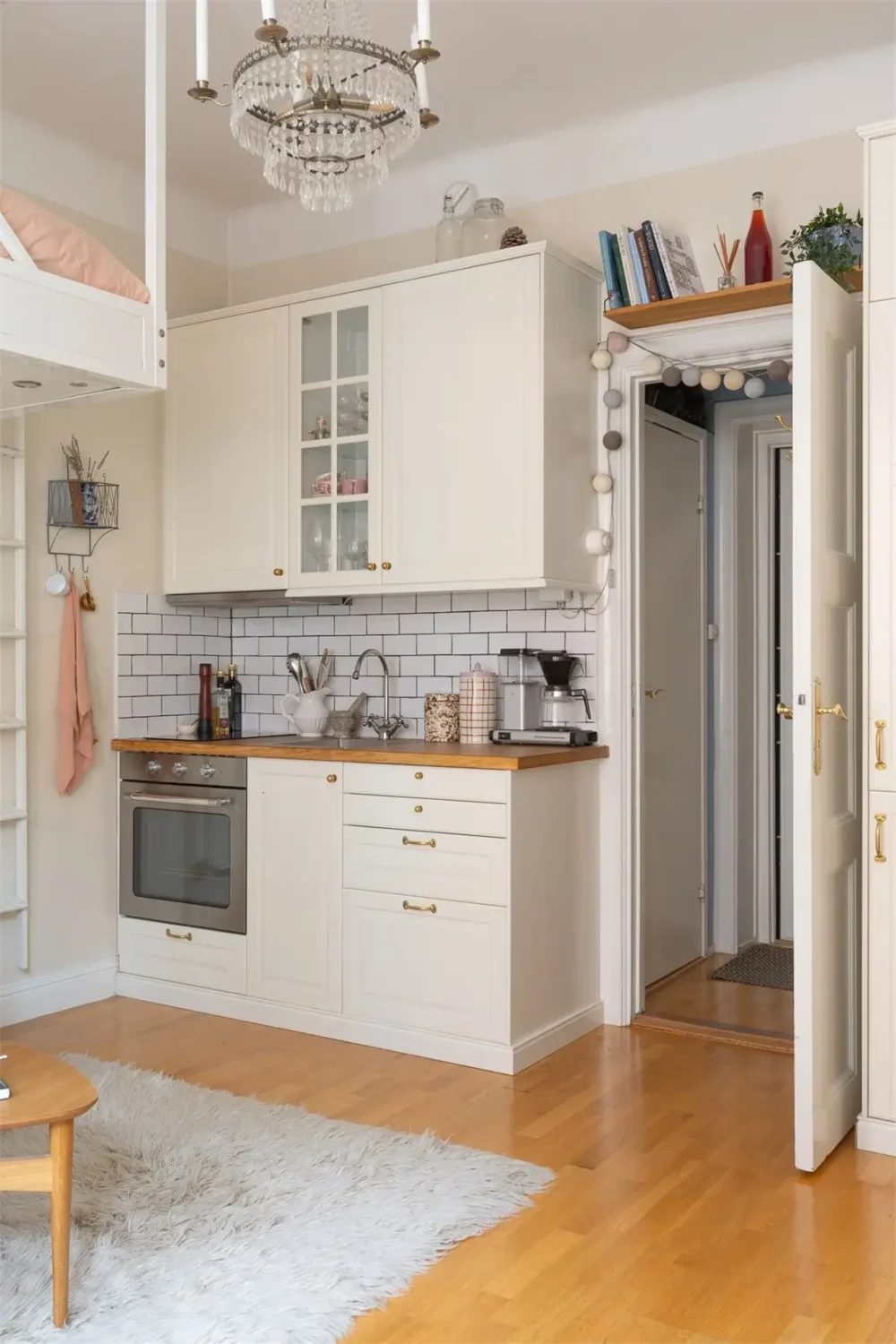 A Studio Apartment with a Large Bay Window and a Loft Bed 12 small-studio-apartment-bay-window-loft-bed-nordroom3
