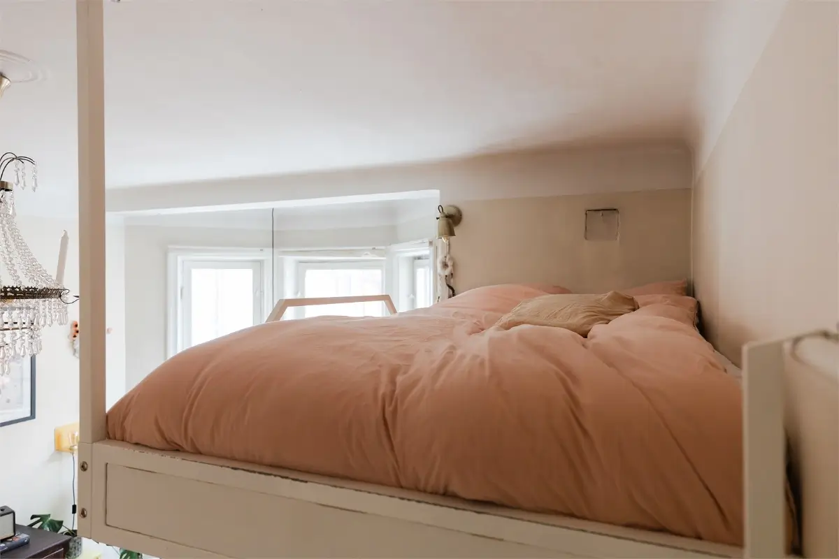 A Studio Apartment with a Large Bay Window and a Loft Bed 13 small-studio-apartment-bay-window-loft-bed-nordroom9