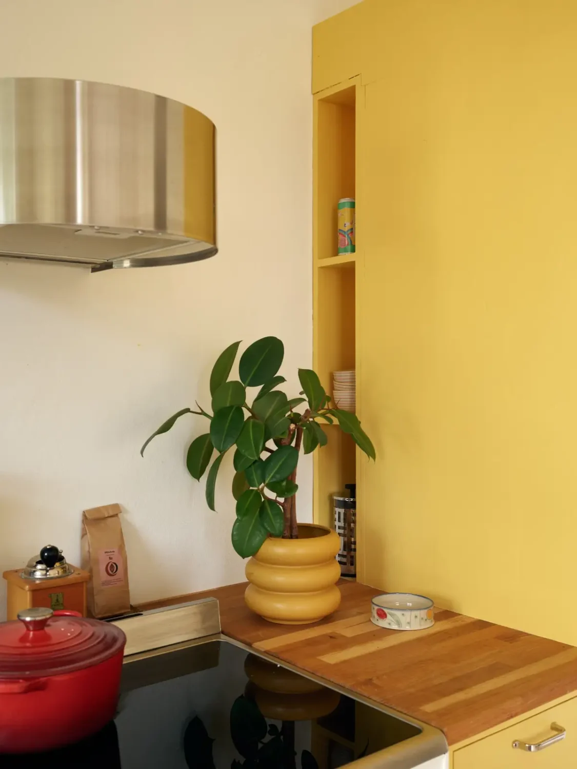 Small Space, Big Style: How to Design a Teeny-Tiny Kitchen That Works 8 tiny-kitchen-yellow-wall-storage-niche-nordroom