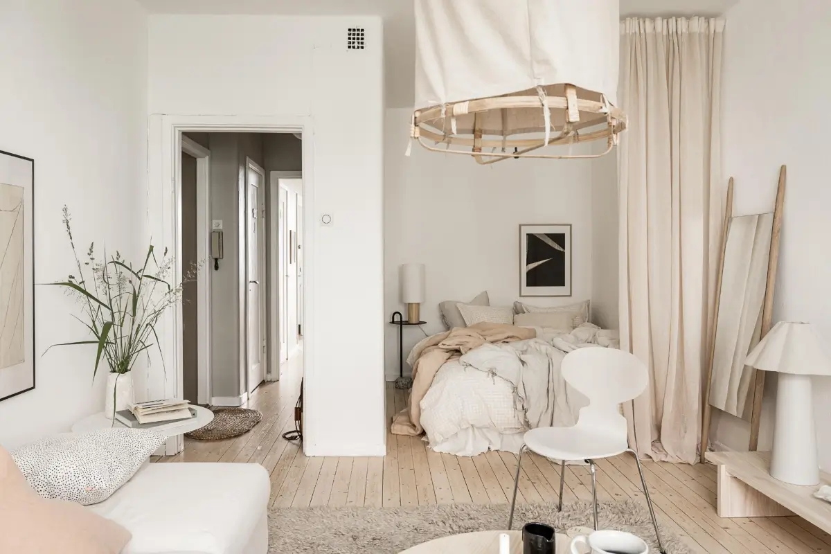 Studio Apartment Layout Ideas: Living Small is Looking Good 35 L-shaped-studio-layout-bed-niche-hidden-by-curtain-nordroom