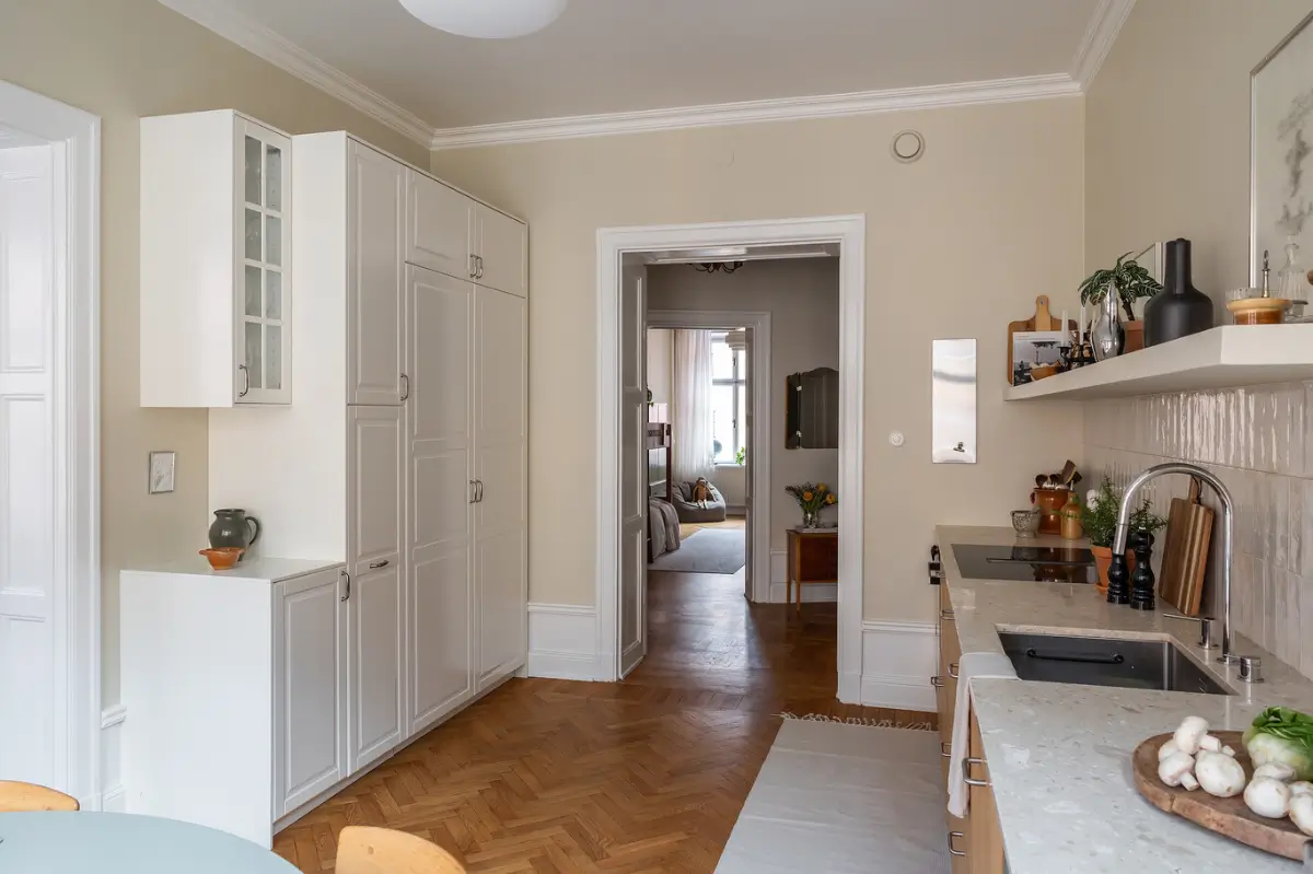 Warm Beige Tones and a Stylish Kitchen in a Stockholm Apartment 17 early-20th-century-apartment-beautiful-kitchen-and-fireplace