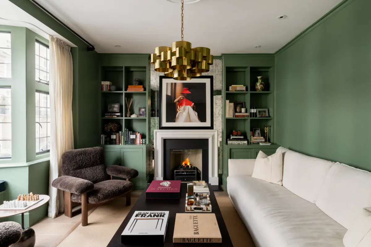 Green Tones in a Narrow Renovated Holland Park Townhouse 2 In addition to the obis, we incorporated Japanese chiyogami paper, using it to create bespoke wallpaper and personalised stationery, adding another layer of detail and individuality to the design.
One of the project's notable challenges was sourcing the perfect sofa that balanced design and comfort. This involved an extensive search, with both our client and team testing many options until we landed on the ideal choice.
The home’s tall, narrow structure required innovative design solutions to optimise the compact spaces without making them feel cramped. The final result is a cohesive and inviting home that perfectly captures our client’s eclectic style.
green-tones-renovated-holland-park-townhouse14